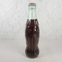 Boston Massachusetts vintage 8 oz full hobbleskirt no refill Coke bottle with Coca Cola Classic cap: Front - Click to enlarge