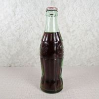 Kearney Nebraska vintage 6 oz full hobbleskirt Coke bottle with red Coca Cola Classic cap: Right - Click to enlarge