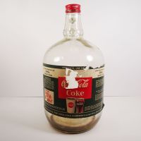 Vintage Coca Cola Coke fountain syrup thumb handle gallon glass jug with paper label and metal screw top: Front - Click to enlarge